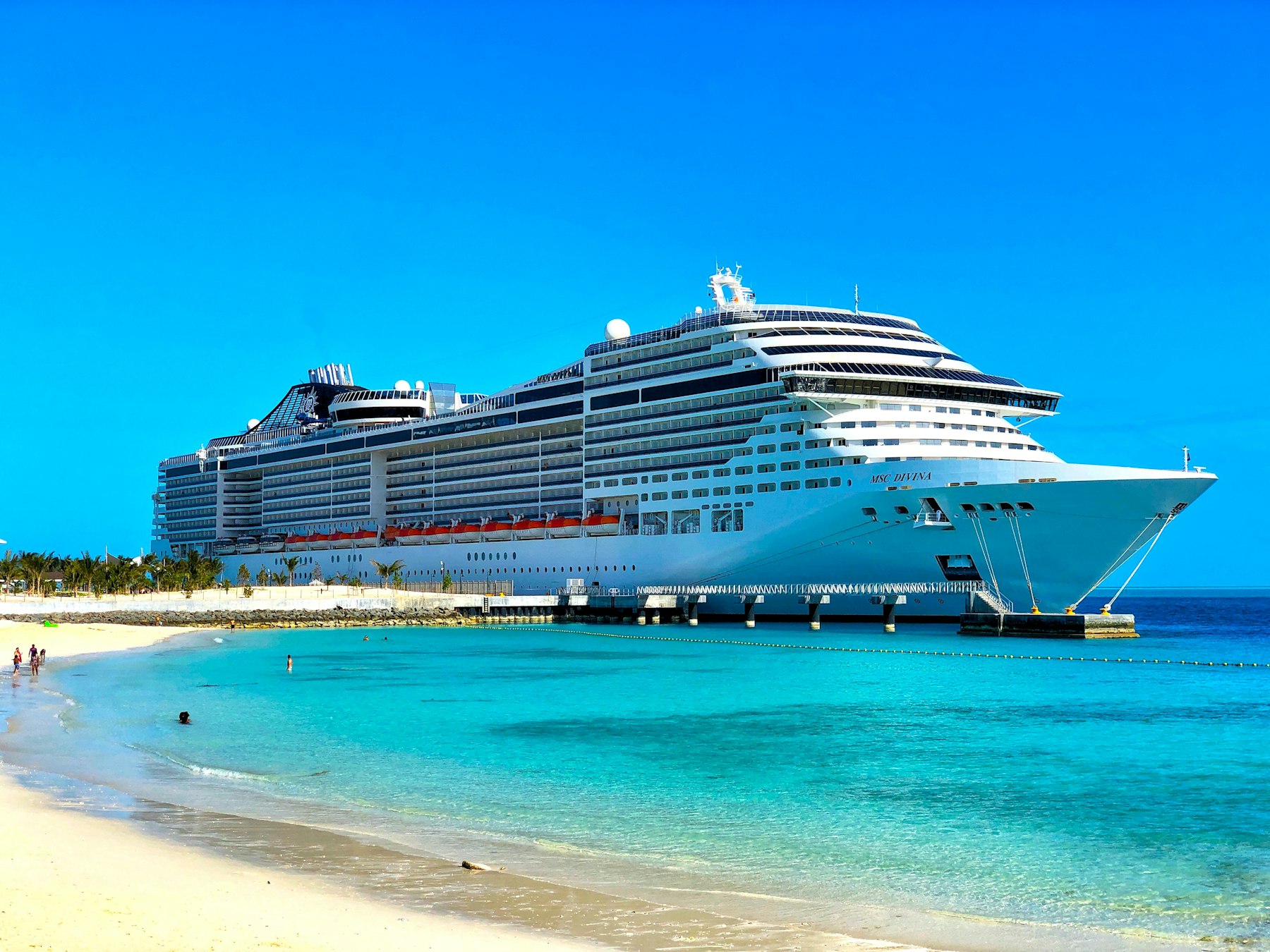 Large cruise ship at a beach port